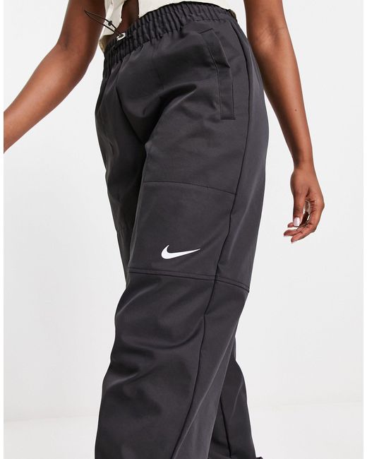 Pantalon cargo tissé à logo virgule Nike en coloris Blue