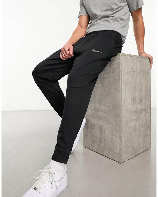 Joggers s therma-fit Nike de hombre de color Black