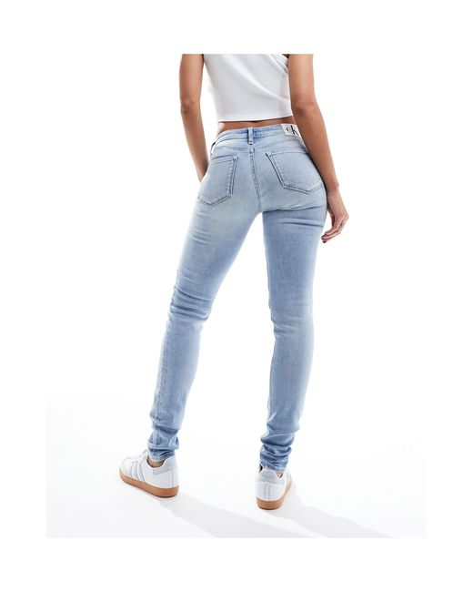 Jean skinny taille mi-haute - bleu clair délavé Calvin Klein en coloris Blue