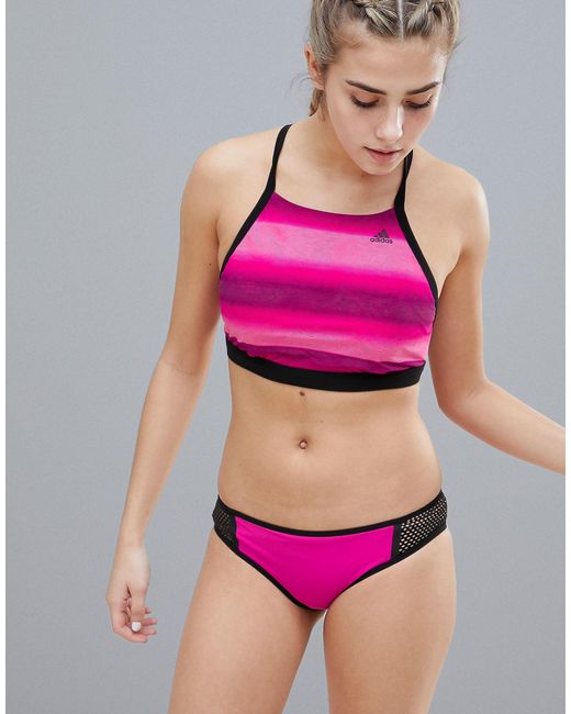 girl in pink adidas bikini
