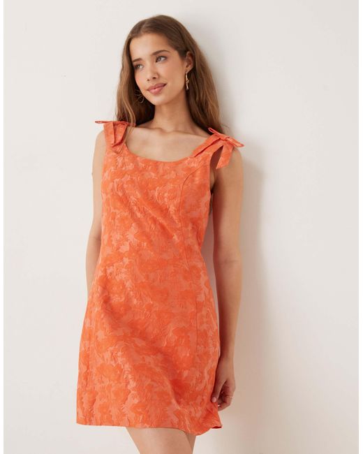 Sister Jane Orange Bow Shoulder Jacquard Mini Dress