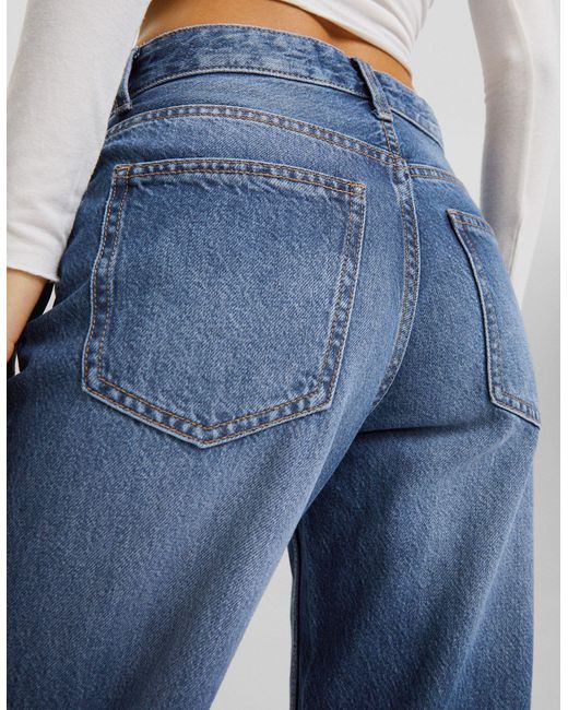 Jeans strappati a fondo ampio anni '90 lavaggio indaco di Bershka in Blue