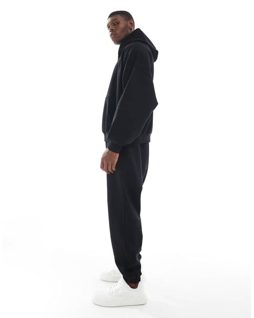 Joggers Negros Holgados Básicos Essentials De ASOS de hombre de color Blue