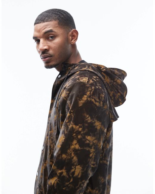 Rains – 12020 – wasserdichte unisex-longline-jacke mit kapuze und abstraktem, verschwommenem muster in Black für Herren