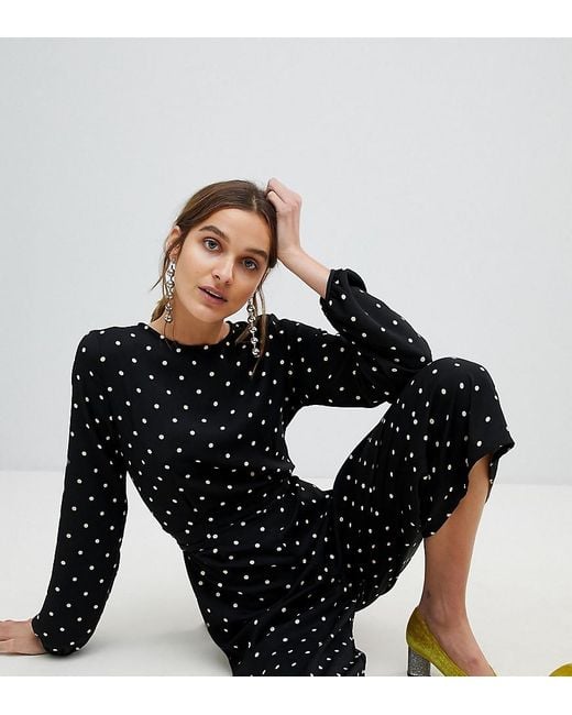 Tuta jumpsuit a pois di Stradivarius in Black