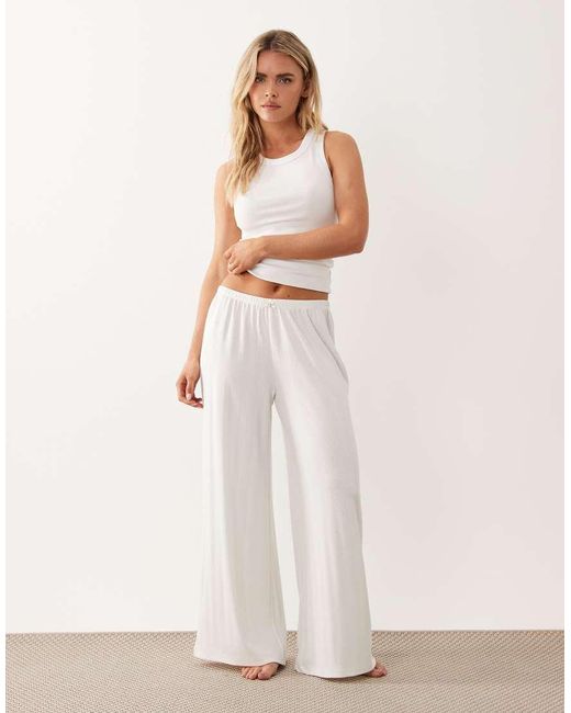 ASOS White Asos Design Petite Pointelle Wide Leg Pyjama Trousers With Rosebud Trim