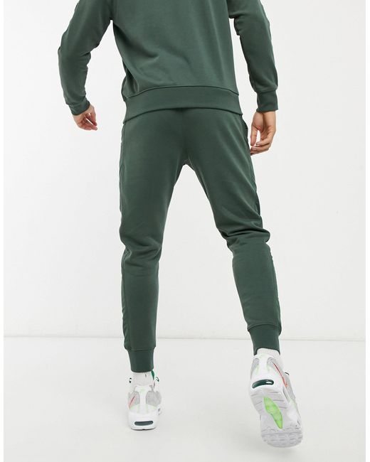 Nike Synthetic Hybrid Cuffed joggers in 
