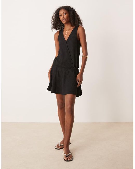 ASOS Black Textured Sleeveless V Front Wrap With Drop Waist Mini Dress