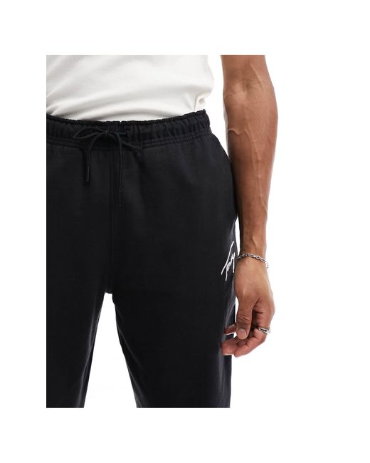 Pantaloni felpati neri vestibilità comoda di Tommy Hilfiger in Black da Uomo