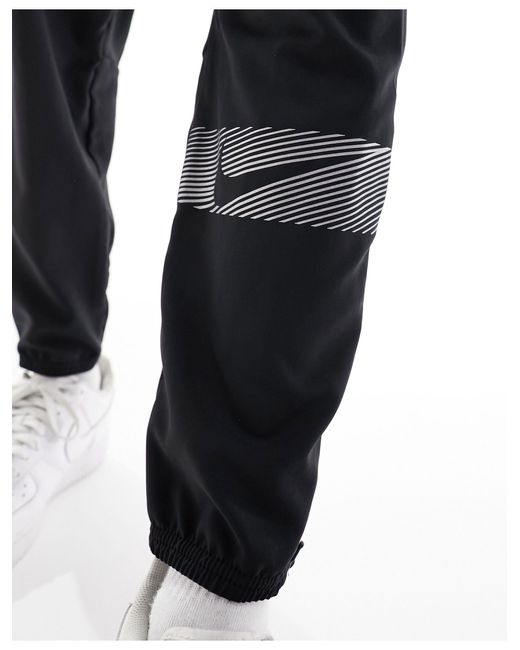 Nike – run division challenger flash – jogginghose aus webstoff in Gray für Herren