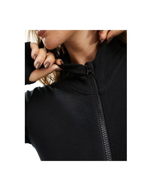 Ski - tuta jumpsuit base layer nera a coste con zip di Threadbare in Black