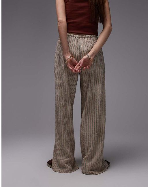 Pantaloni A Vita Bassa Con Fondo Ampio Allacciati di TOPSHOP in Brown