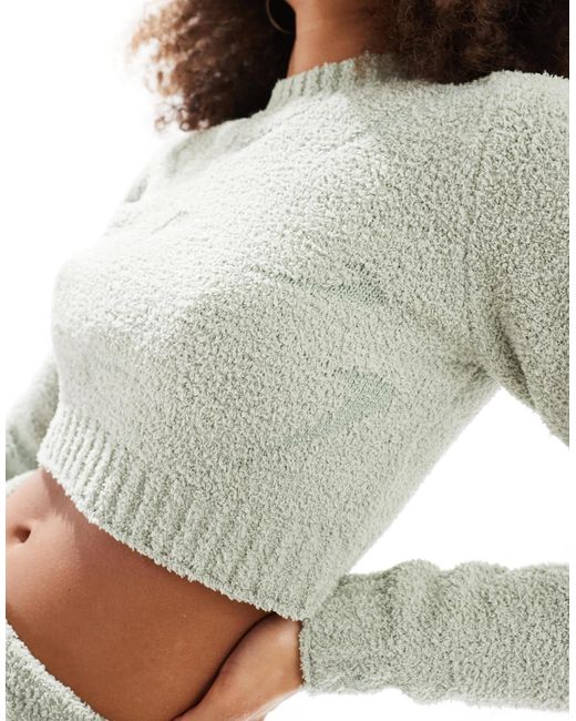 Phoenix - crop top bouclé à manches longues avec petits logo virgule - clair Nike en coloris Gray