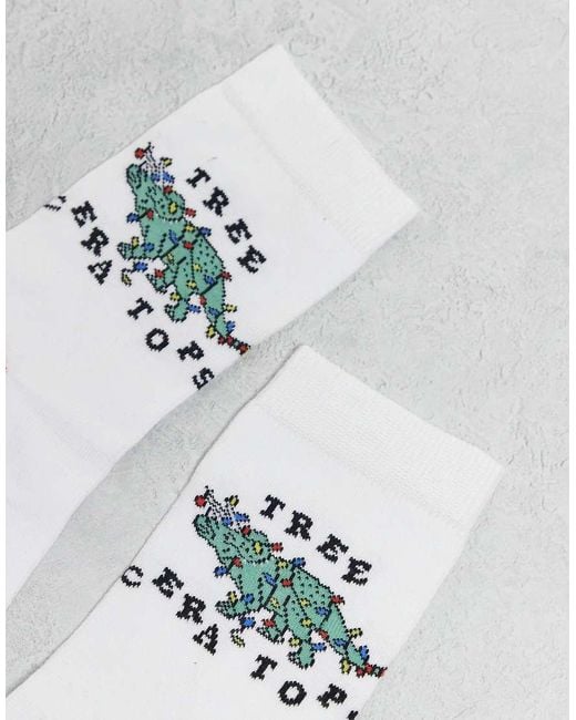 Calcetines Blancos Para Navidad Con Estampado Gráfico De Dinosaurio De ASOS de hombre de color White