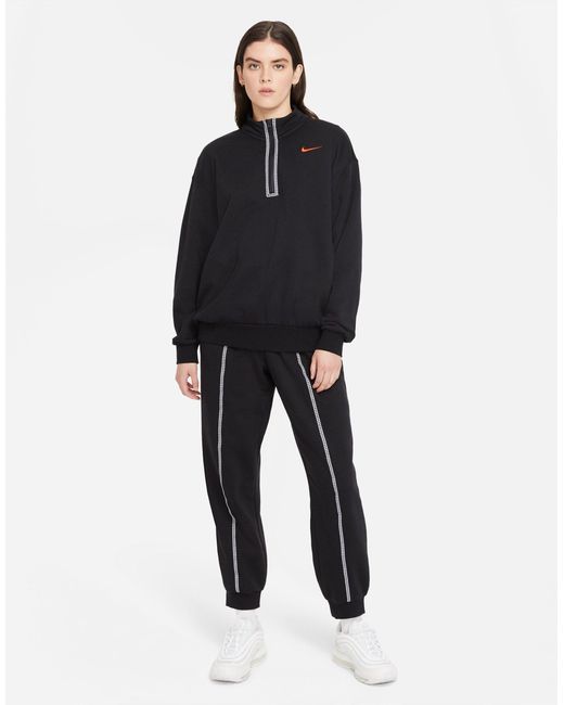nike repeat pack taping cuffed sweatpants in black