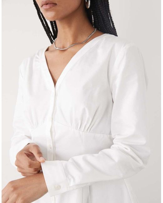 Reclaimed Vintage White Cinched -n Shirt With Seam Details And Peplum Hem