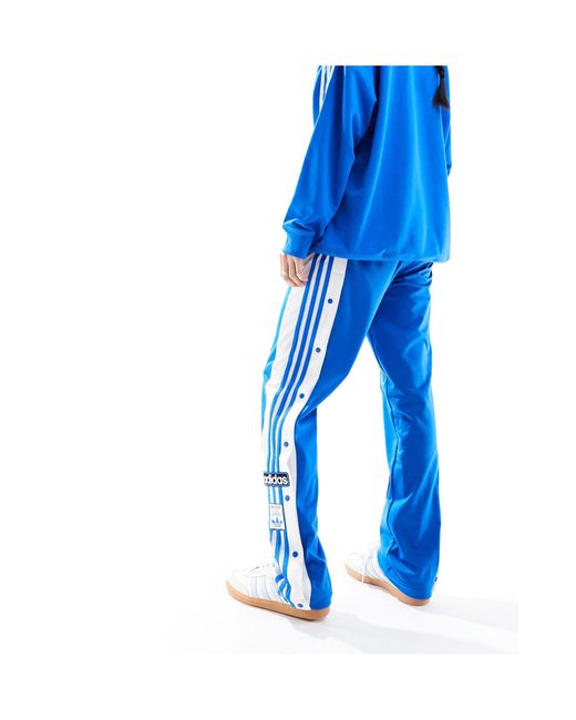 Pantalones azul azulejo con botones Adidas Originals de color Blue