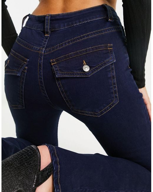 Flared Jeans Met Lage Taille En Western Zakken in het Blauw | Lyst NL