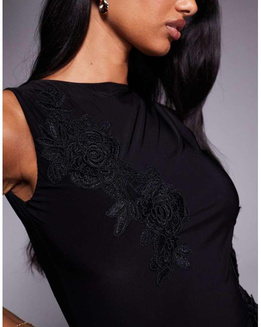 Fashionkilla Black Double-sculpted Slinky Slash Neck Low Back Ruffle Hem Flower Applique Mini Dress