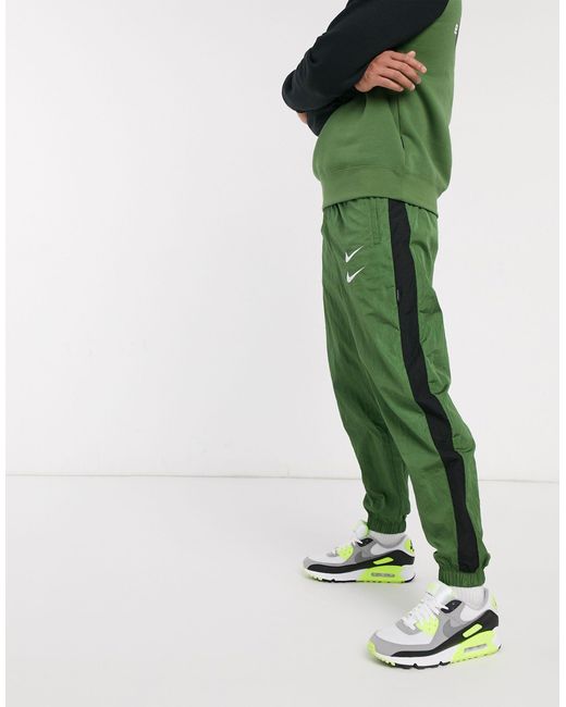 Nike Swoosh - Geweven joggingbroek Met Boorden in het Green voor heren