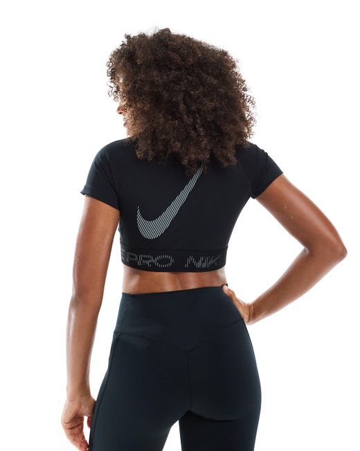 Nike - pro - t-shirt crop top Nike en coloris Black