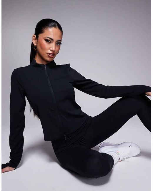 Top De Manga Larga Con Cremallera De Tejido Suave Dri-Fit Zenvy De Nike de color Blue
