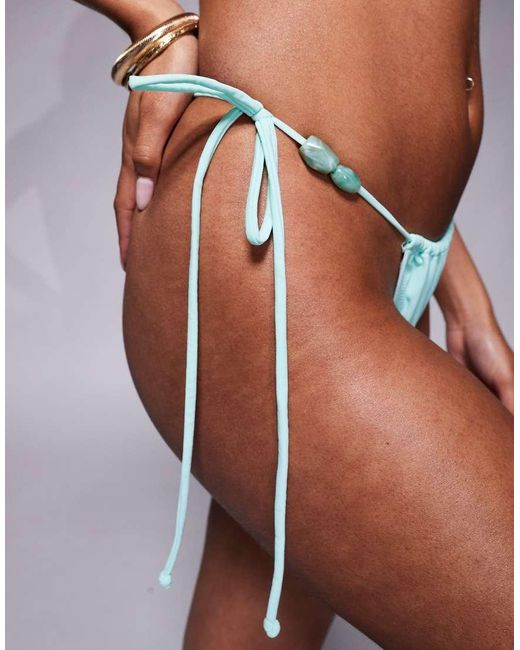 Slip Bikini Color Acqua Con Allacciatura Laterale E Perline di Candypants in Blue