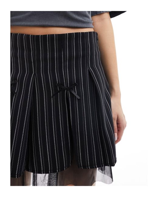 Minifalda con raya diplomática, volantes y lazos Reclaimed (vintage) de color Black