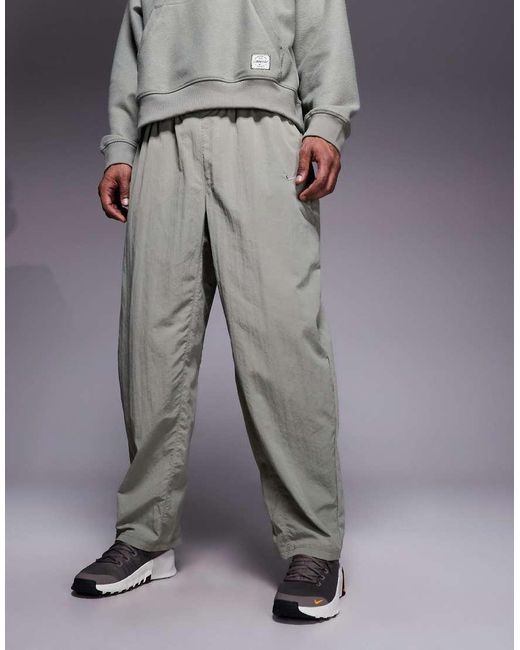 Nike Gray Athletic Club Badge Logo Track Pants for men