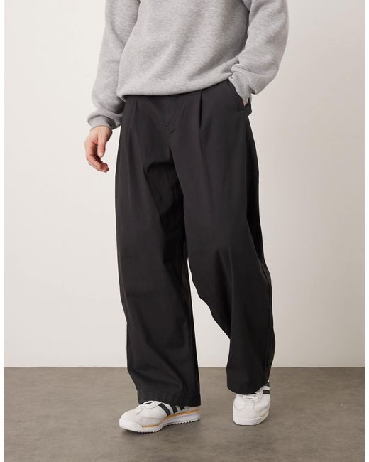 Pantalon oversize coupe baggy à pinces ASOS pour homme en coloris Black