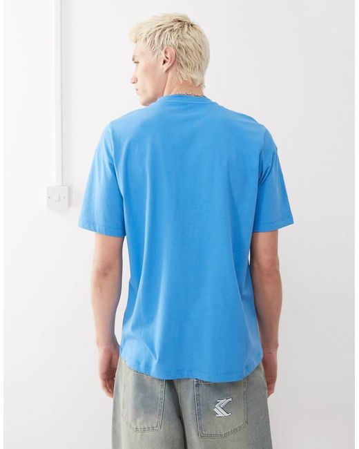 Camiseta De Corte Skater Con Estampado Gráfico De Leche De Collusion de hombre de color Blue