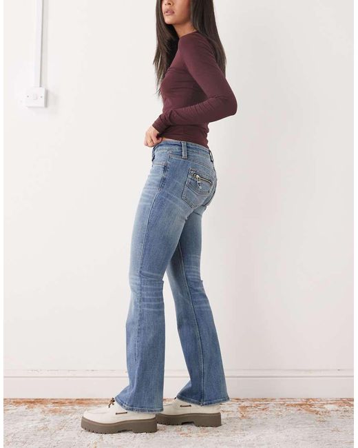 Monki Blue Back Pocket Detail Flared Jeans