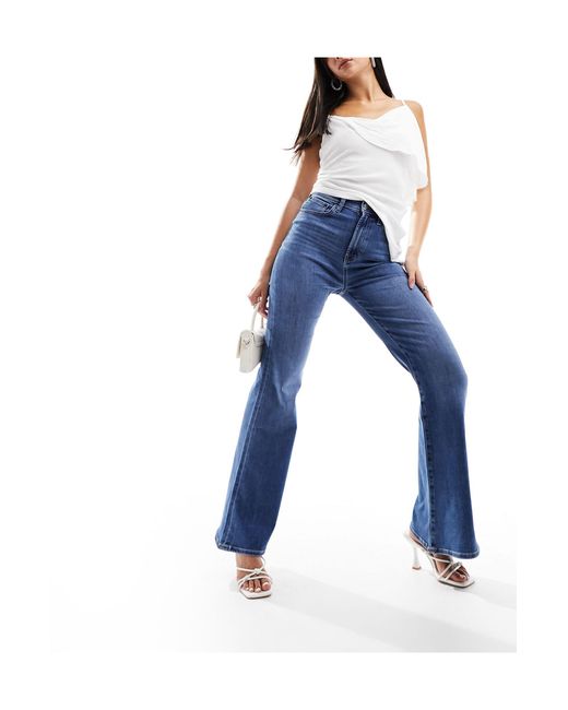 Jeans a zampa anni '70 power stretch medio di ASOS in Blue