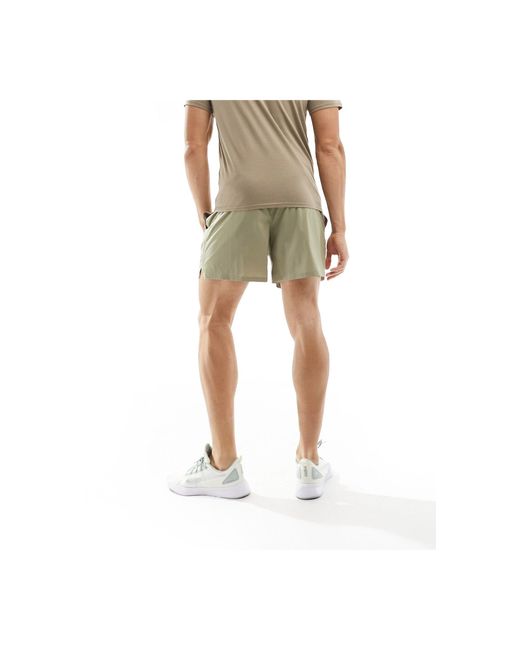 Training evolve - short tissé - beige PUMA pour homme en coloris Green