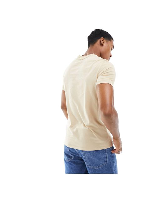 Camiseta con logo lineal Armani Exchange de hombre de color White