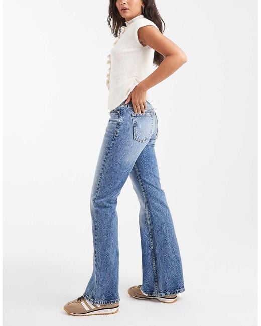 Vaqueros De Campana Azules De Talle Medio Con Lavado Medio De ASOS de color Blue
