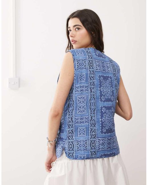 Reclaimed (vintage) Omkeerbare Gewatteerde Bodywarmer Met Print En Gestrikte Voorkant in het Blue