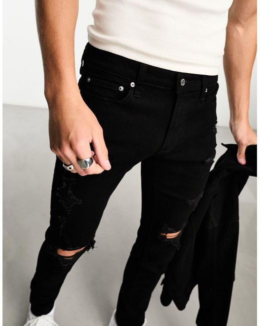 Hollister Stacked Skinny fit Distressed Jeans in het Zwart voor