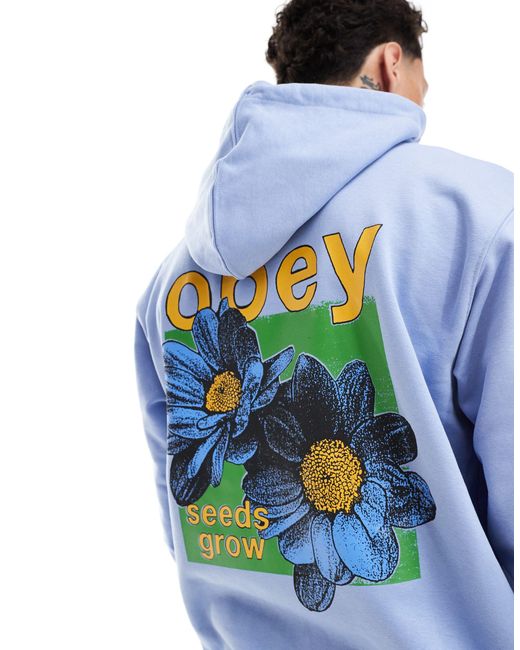 Felpa con cappuccio unisex azzurra con grafica di fiori di Obey in Blue