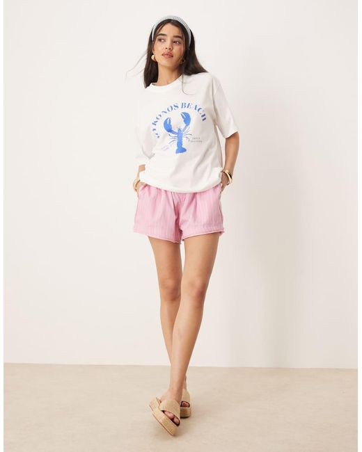 Gina Tricot Oversized T-Shirt Met Korte Mouwen En Mykonos Strandprint in het Pink