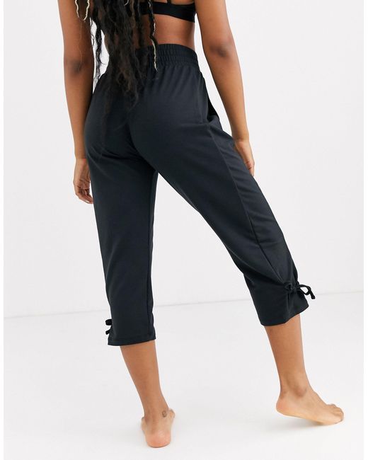 Nike Synthetic Nike Yoga Loose Fit Pants With Tie Detail in Black | Lyst