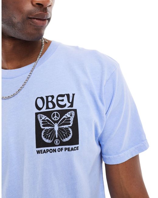 T-shirt unisex con grafica "weapon of peace" di Obey in Blue