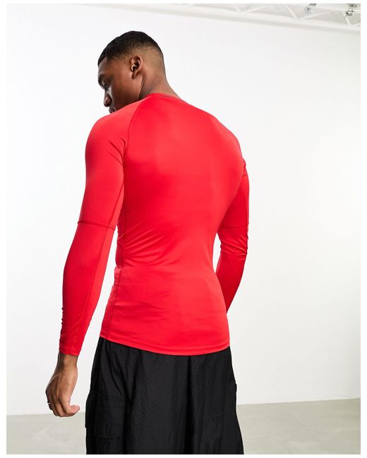 Pro dri-fit - t-shirt aderente rossa a maniche lunghe di Nike in Red da Uomo