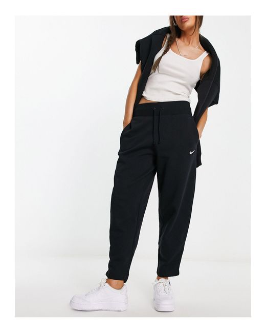 Nike Mini Swoosh High Rise joggers in Black Lyst UK