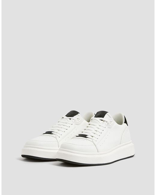 white trainers black back
