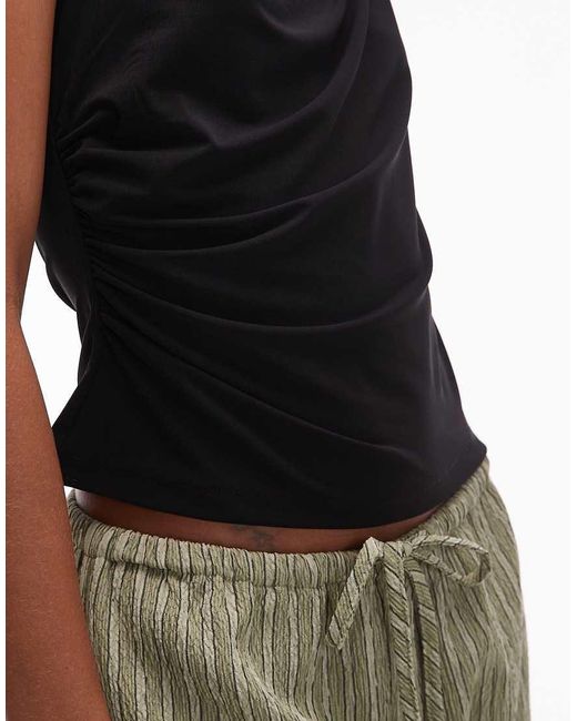 Top Sin Mangas Elástico Con Cuello Drapeado De Mango de color Black