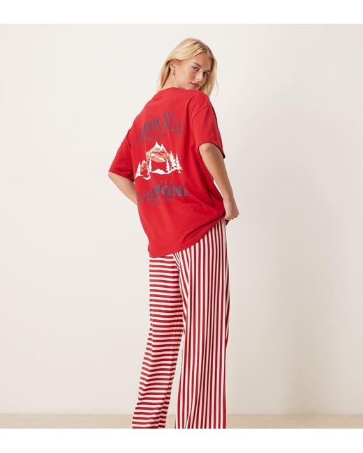 Pijama De Pantalones De Pernera Ancha Y Camiseta Extragrande Con Estampado "Après Ski" De Asos Design Tall ASOS de color Red