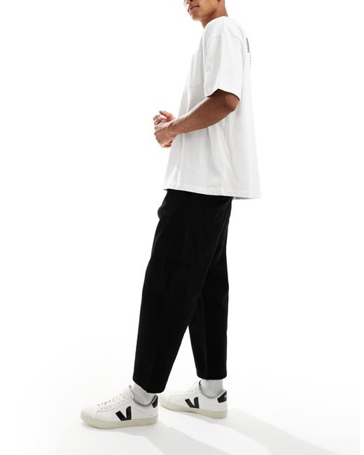 ASOS – schmal zulaufende relaxed fit cargohose in Black für Herren
