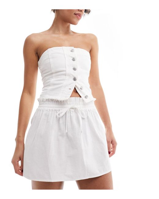 Minifalda blanca con lazada en la cintura ASOS de color White