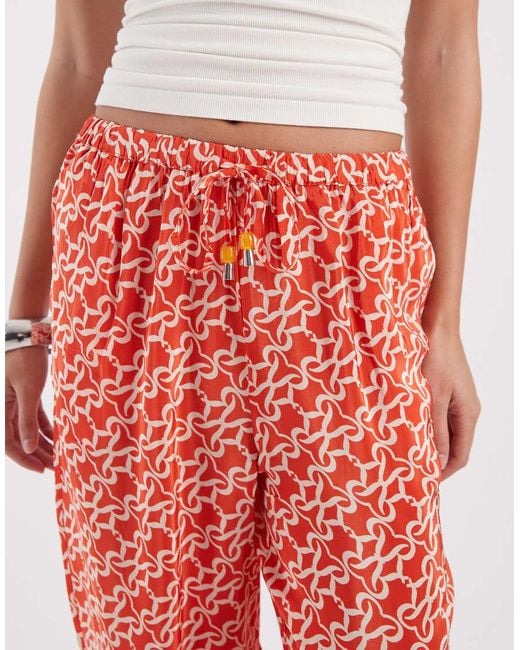River Island Red Monogrammed Print Trousers